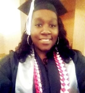 Medical Assistant graduate Shauna Matthews is all smiles as she celebrates her academic accomplishment