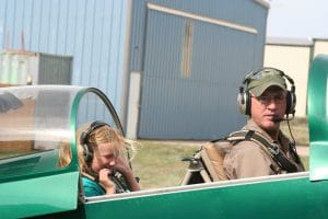 Brad enjoys his favorite downtime passion, flying his two-seater airplane. Pictured with Loren Schowengerdt.