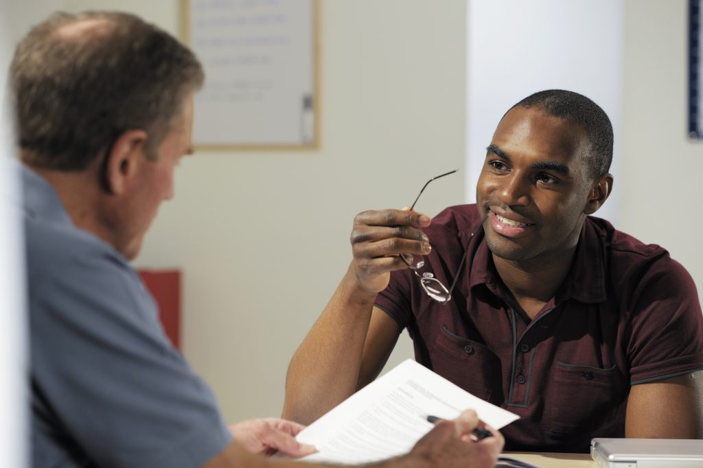 A student meets with a financial aid advisor